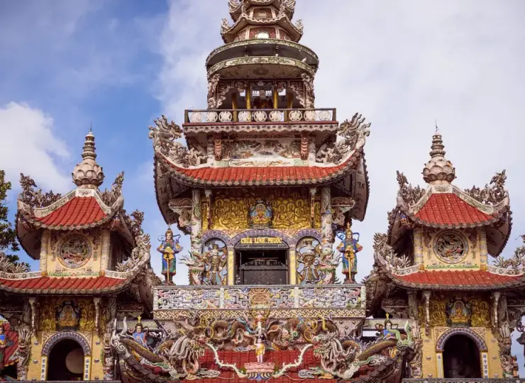 Ornate temple tower rising above colorful roof details