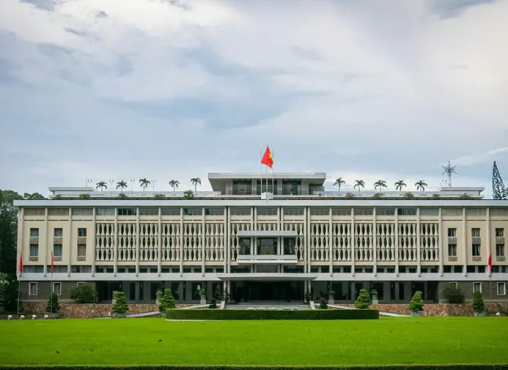 White Independence Palace building with a flag on top in Ho Chi Minh City