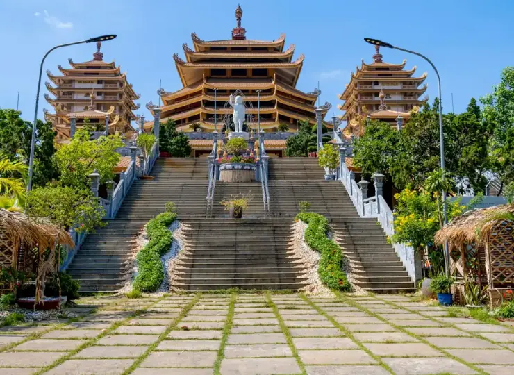 Minh Dang Quang Buddhist Temple with ornate tiered roofs and stairs in Ho Chi Minh City