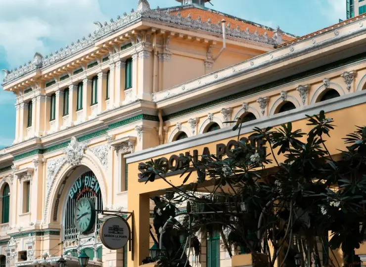 Exterior of Saigon Central Post Office behind a fence in Ho Chi Minh City