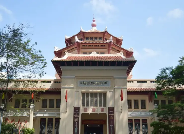 Vietnam History Museum building framed by trees in Ho Chi Minh City