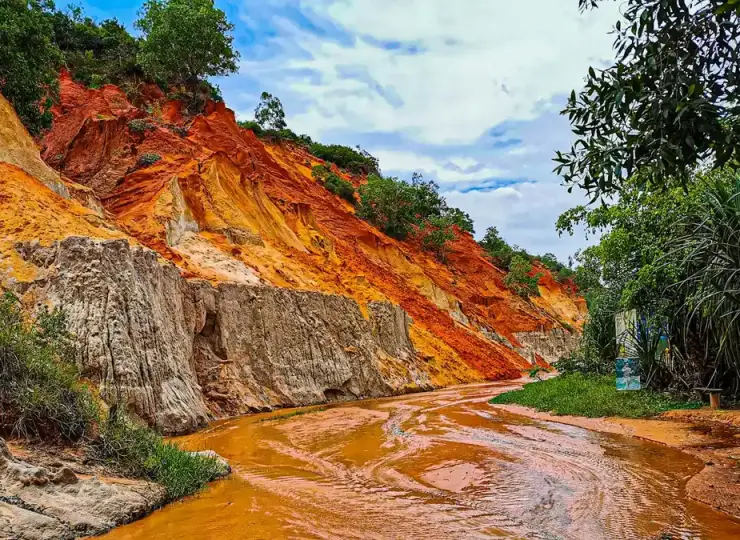 Red and white rocky sand formations at Fairy Stream near Mui Ne
