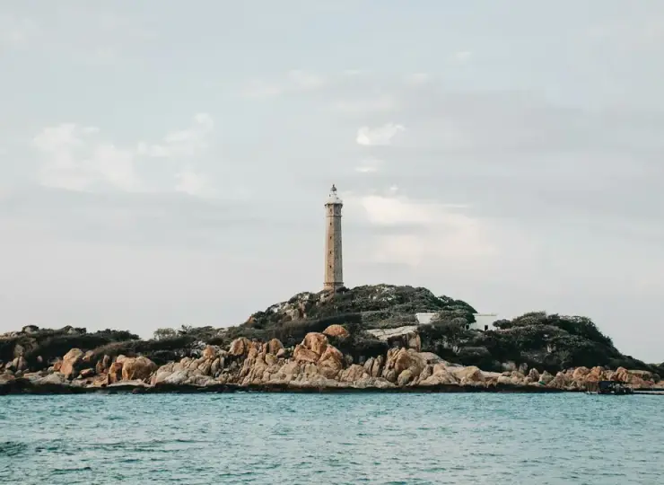 Ke Ga Lighthouse on a rocky coastal island near Phan Thiet