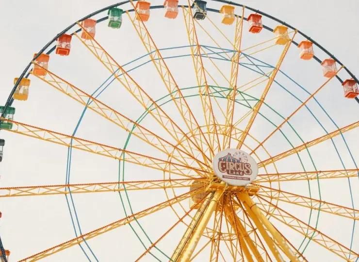 Colorful ferris wheel against a bright sky