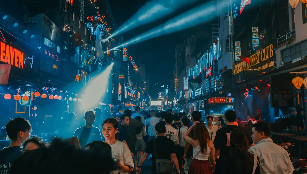 Crowded Bui Vien Walking Street with neon signs and nightclub lights